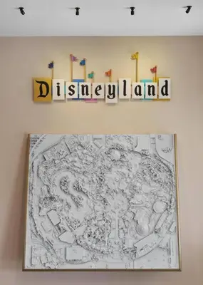 a drawing of disneyland is on a wall at The Disneyland Dream by OC Adventure Homes in Garden Grove