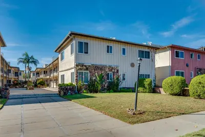 a row of houses on a street at LA Condo about 1 Mi to The Kia Forum and SoFi Stadium in Inglewood