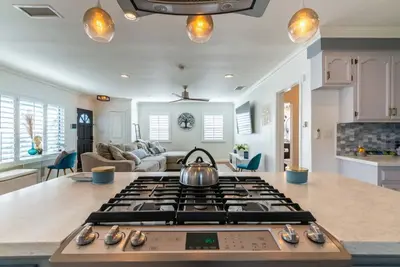 a tea kettle sitting on top of a stove in a kitchen at Coastal Retreat With a minimum stay of 30 days in Lakewood