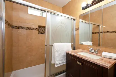 a bathroom with a shower and a sink at Beautiful Spacious Home in Los Angeles