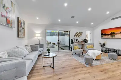 a living room with a couch and a table at LA Home near Universal Studios and Hollywood in Los Angeles