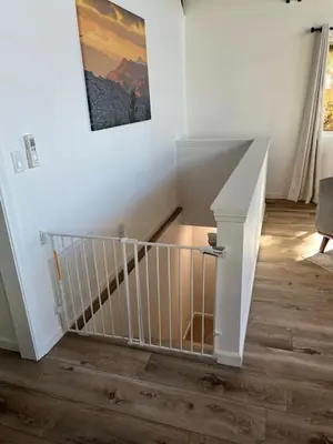 a stairway with a white railing and a stair case at EV level 2, Pets Welcome at Sunset Ridge in Lake Arrowhead