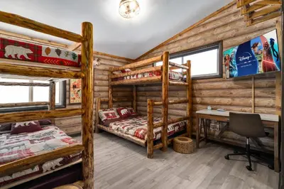 a bedroom with two bunk beds and a desk at Great Outdoors by OC Adventure Homes in Garden Grove