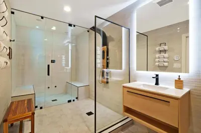 a bathroom with a sink and a glass shower at Great Outdoors by OC Adventure Homes in Garden Grove