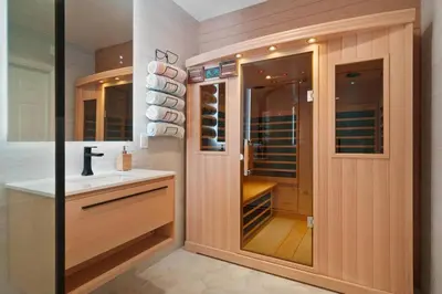 a bathroom with a sink and a glass door at Great Outdoors by OC Adventure Homes in Garden Grove