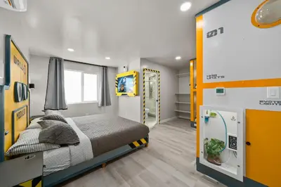 a bedroom with a bed in a room at Galaxy Quest by OC Adventure Homes in Garden Grove