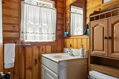 a bathroom with a sink and a mirror at Boulder Bay Getaway in Big Bear Lake