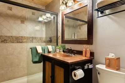 a bathroom with a sink and a shower at Slope Vista Escape in Fawnskin