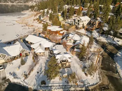 an aerial view of a resort with snow covered roofs at Roaring Lion Lakefront Lodge in Big Bear Lake