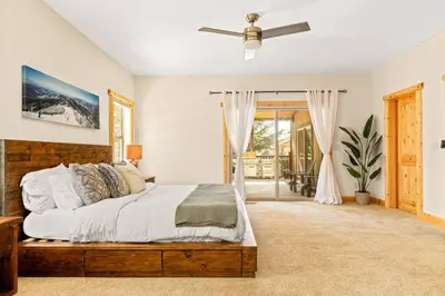 a bedroom with a bed and a ceiling fan at Zen Mountain Retreat in Big Bear Lake