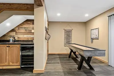 a kitchen with a ping pong table in a room at The Great Escape in Big Bear Lake