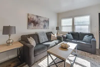 a living room with a couch and a table at Van Nuys Abode with Patio, 7 Mi to Universal Studios in Van Nuys