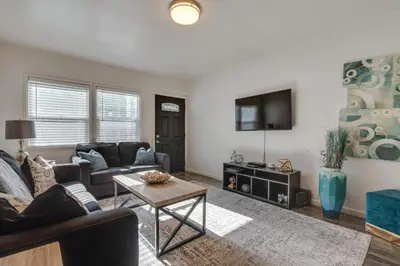 a living room with a couch and a table at Van Nuys Abode with Patio, 7 Mi to Universal Studios in Van Nuys
