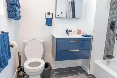 a bathroom with a toilet and a sink and a tub at Beautiful hillside gateway in Los Angeles