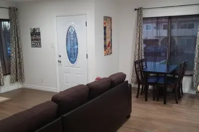 a living room with a couch and a table at Family getaway 3 BR 2 Bath home in Lomita, CA. in Los Angeles