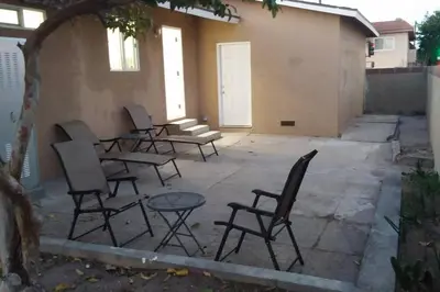 a group of chairs and tables on a patio at Family getaway 3 BR 2 Bath home in Lomita, CA. in Los Angeles