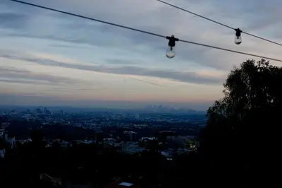 a group of shoes hanging from a wire in a city at Hollywood Hills Haven-Guest House in Los Angeles