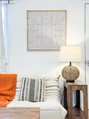 a living room with a white couch and a lamp at Modern 2-Bedroom Gem Close to Beverly Hills - DOH2 in Los Angeles