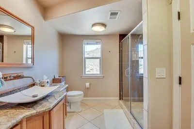 a bathroom with a sink toilet and a shower at Expansive Mountain Gem Game Room, 3 Mi to Acton in Ravenna