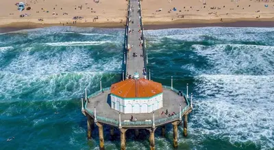 an aerial view of a pier on the beach at NEW! Ocean View Mid-Century Modern Beach House in Manhattan Beach