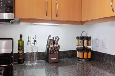 a kitchen counter with knives and utensils on it at 2 Santa Monica Beach Walking in Los Angeles