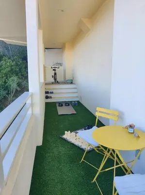 a room with a table and chairs and green carpet at Epic Views! Hollywood Hills SkyVilla: Crow's Nest in Los Angeles