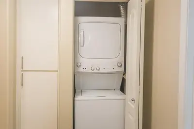 a small kitchen with a microwave and a refrigerator at Sunny Living l Walk to the Marina in Los Angeles