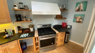 a kitchen with a stove and a counter top at Malibu Ranch Guest House Hideway in Malibu