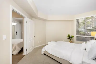 a white bedroom with a large bed and a window at Charming & Peaceful l 1 bedroom in Marina Del Rey, CA in Los Angeles