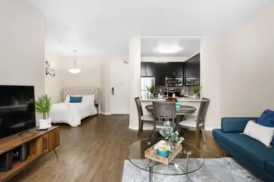 a living room with a blue couch and a table at Charming & Peaceful l 1 bedroom in Marina Del Rey, CA in Los Angeles