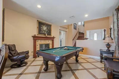 a room with a pool table and a fireplace at ৎ୭The safty paradiseৎ୭ H/w Pool Jacuzzi &much more in Los Angeles