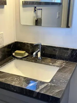 a sink in a bathroom with a mirror at The Verna Mae in Los Angeles
