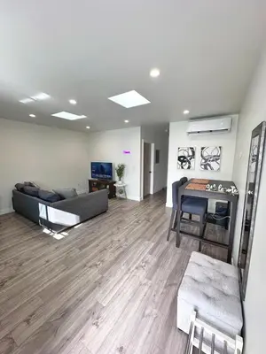 a living room with a couch and a table at New built house in Los Angeles! in Los Angeles