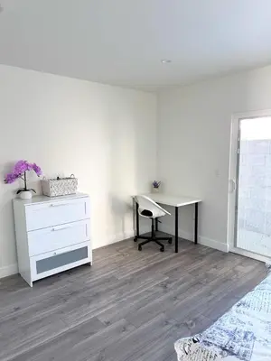 a bedroom with a desk and a dresser and a desk at New built house in Los Angeles! in Los Angeles