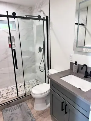 a bathroom with a shower with a toilet and a sink at New built house in Los Angeles! in Los Angeles