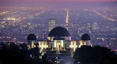 a building on top of a hill at night at Crenshaw Inn Motel in Los Angeles