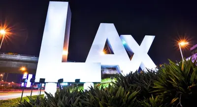 a large lit up sign in a city at night at Crenshaw Inn Motel in Los Angeles