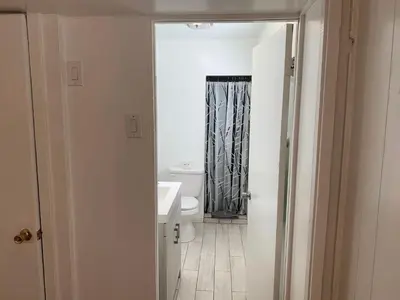 a bathroom with a white toilet and a sink at Snow Bear Lodge in Big Bear Lake