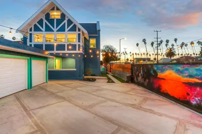 a large house with a garage in front of it at Peace palace in Los Angeles