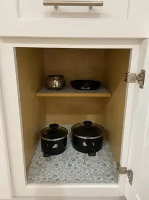 three pots on a shelf in a room with a wall at New! Cozy Gated 3BR, 2BA Vacation Home in Rosemead