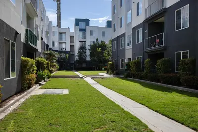 an apartment yard with grass between two buildings at Playa Vista 2br w pool gym wd nr 405 LAX-985 in Los Angeles