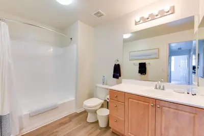 a bathroom with a sink and a toilet and a shower at Spacious, Comfortable, and Central Condo in Los Angeles
