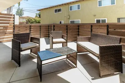 a group of chairs and tables on a patio at Redondo Beach 2br walk to shops restaurants LAX-1166 in Torrance