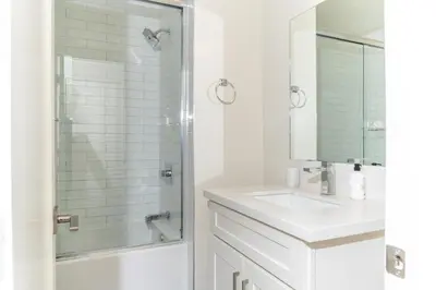 a white bathroom with a shower and a sink at Redondo Beach 2br walk to shops restaurants LAX-1166 in Torrance