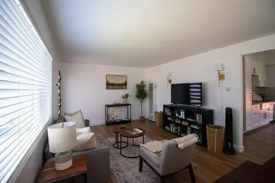 a living room with a couch and a tv at Comfortable & Modern 3BD/2BA Home -pet friendly! in Lawndale