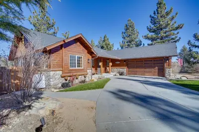 a log cabin house with a driveway at Big Bear Lake Cabin with Hot Tub and Gas Fire Pit! in Big Bear Lake