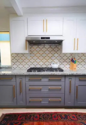 a kitchen with white cabinets and a stove at SeaView, Pool, HotTub, W/D, Bikes, Gated Community in Port Hueneme
