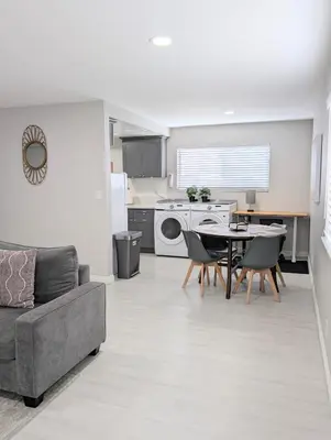 a kitchen and living room with a couch and a table at 5 Mins to DT Alhambra - Homey 2BR Apt 4A in Alhambra