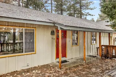 a house with a red door in front of it at Timber Pines Chalet~ Hot Tub~ Walk to Lake/Marina~ in Big Bear Lake
