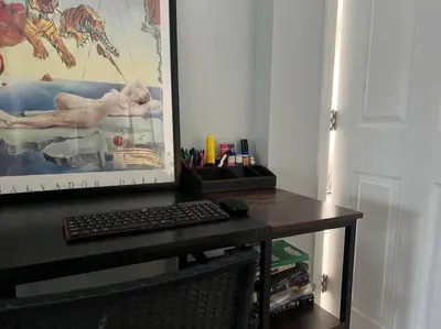 a desk with a keyboard and a computer on it at Walk To Americana on Brand. in Glendale